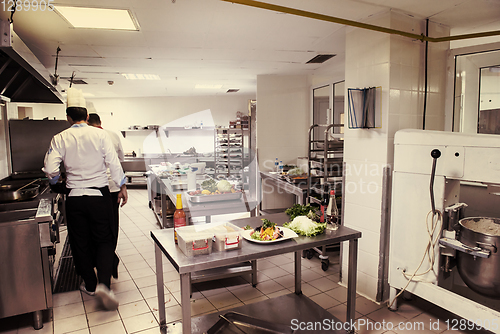 Image of team cooks and chefs preparing meals