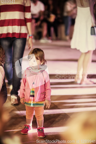 Image of little girl dancing in the kids disco