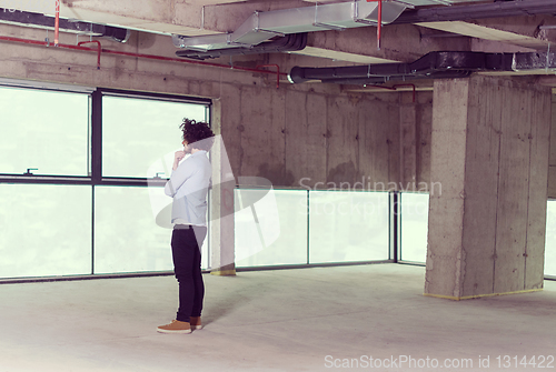 Image of portrait of young male architect on construction site