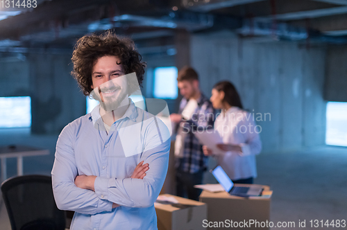 Image of young businessman on construction site