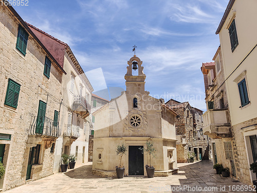 Image of Small church on square of small urban village of Stari grad on Hvar island in Croatia, Adriatic Sea, Europe.