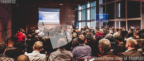 Image of Speaker giving presentation on business conference meeting.