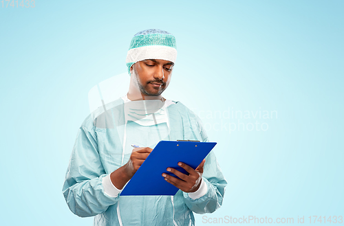 Image of indian male doctor or surgeon with clipboard