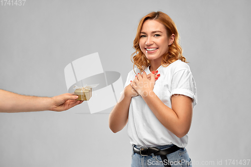 Image of happy couple in white t-shirts with christmas gift