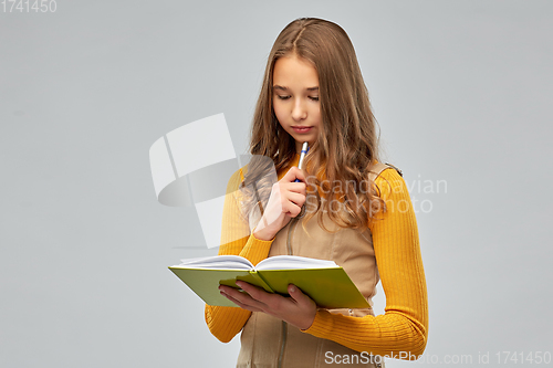 Image of teenage student girl with notebook or diary