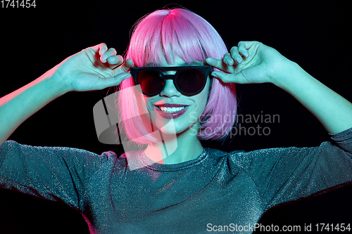 Image of happy woman in pink wig and black sunglasses