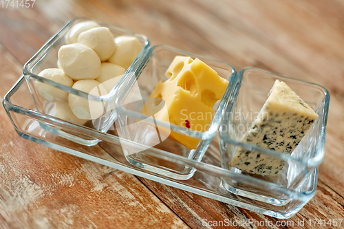 Image of different kinds of cheese in glass cups