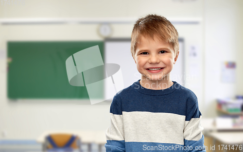 Image of happy smiling little boy at school