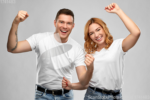 Image of portrait of happy couple in white t-shirts
