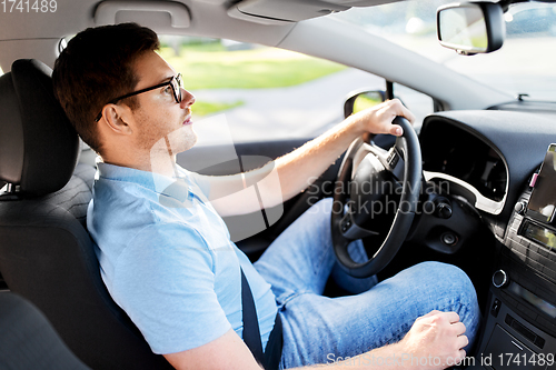 Image of man or driver in glasses driving car in summer