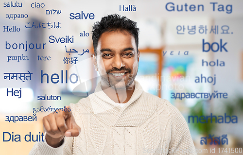 Image of indian man over words in foreign languages