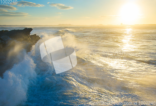 Image of Ocean rocky beach at sunset