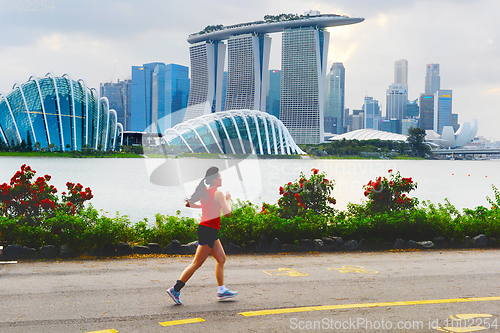 Image of Woman jogging in Singapore bay