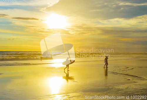 Image of Surfer with surfboard, tropical beach