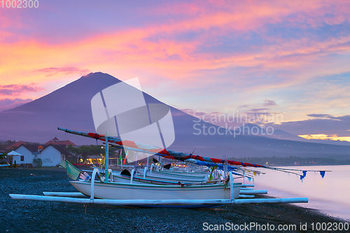 Image of Volcano, ocean, fishing boats. Bali