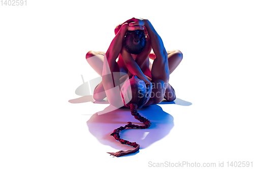 Image of Sensual fit couple isolated on white studio background in neon light