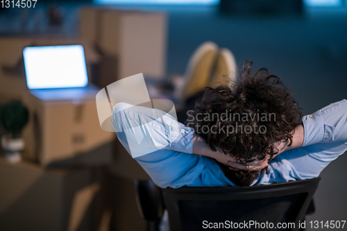 Image of young business man taking a break on construction site