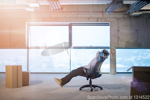 Image of young business man taking a break on construction site