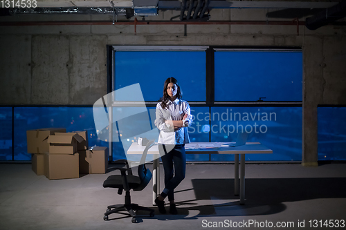 Image of young female architect and engineer on construction site