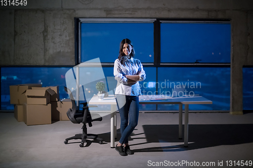 Image of young female architect and engineer on construction site