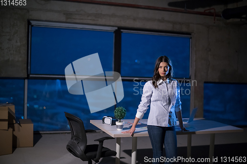 Image of young female architect and engineer on construction site