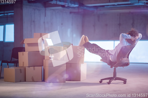 Image of young business man taking a break on construction site