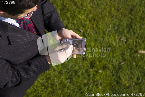 Image of businessman working with a palmtop