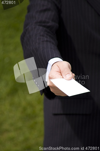 Image of Businessman showing a blank card