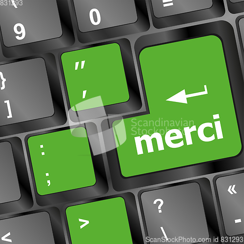 Image of thank you (merci) word on computer keyboard key