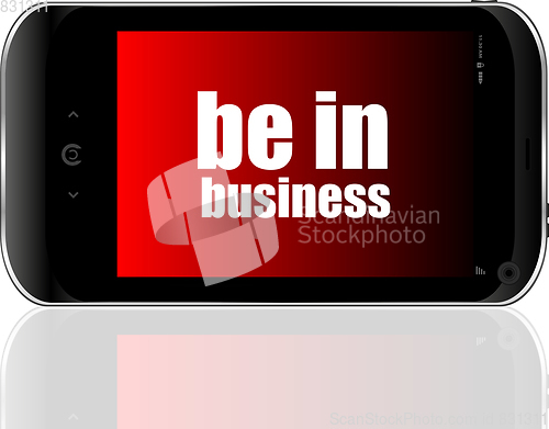 Image of Business concept. smartphone with text be in business on display