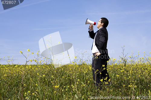 Image of Businessman speaking with a megaphone