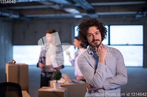 Image of young businessman on construction site