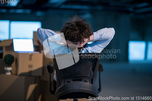 Image of young business man taking a break on construction site