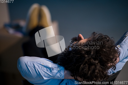 Image of young business man taking a break on construction site