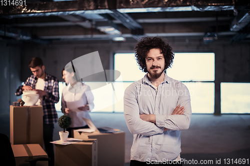 Image of young businessman on construction site