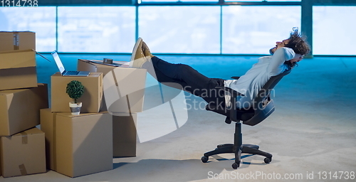 Image of young business man taking a break on construction site