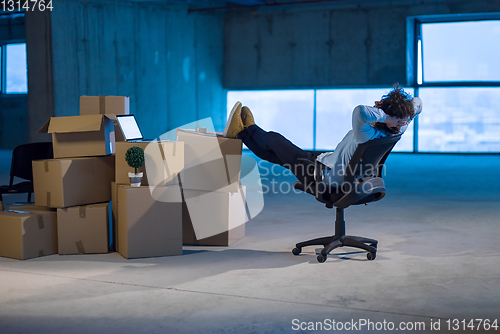 Image of young business man taking a break on construction site