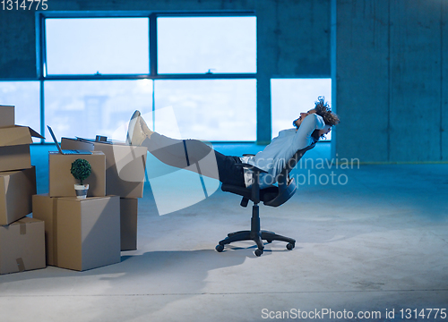 Image of young business man taking a break on construction site