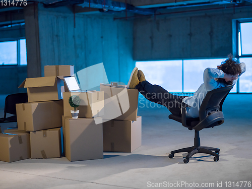 Image of young business man taking a break on construction site