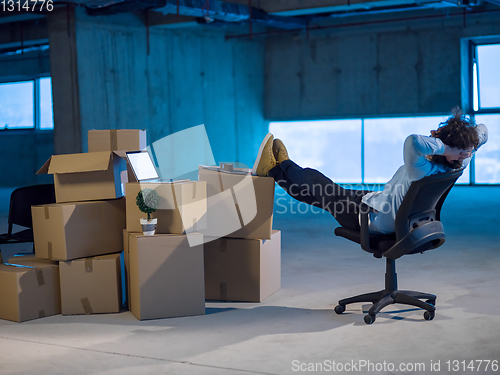 Image of young business man taking a break on construction site