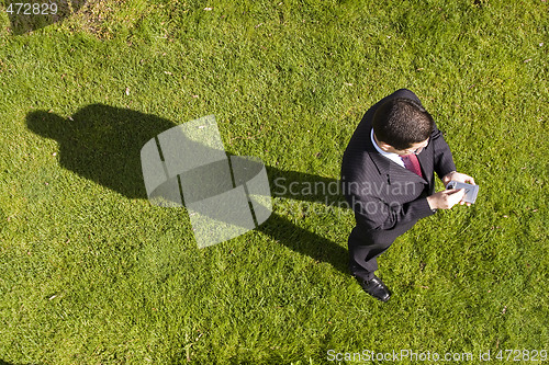 Image of businessman working with a palmtop