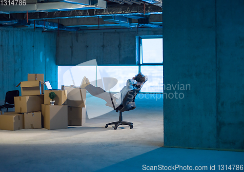 Image of young business man taking a break on construction site