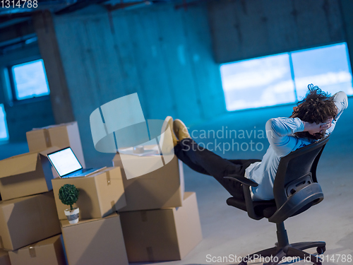 Image of young business man taking a break on construction site