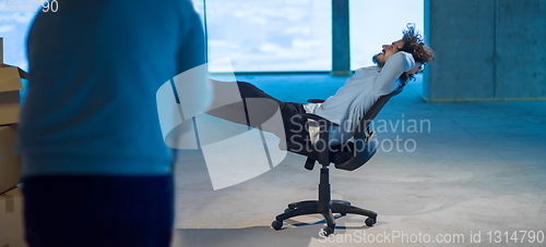 Image of young business man taking a break on construction site