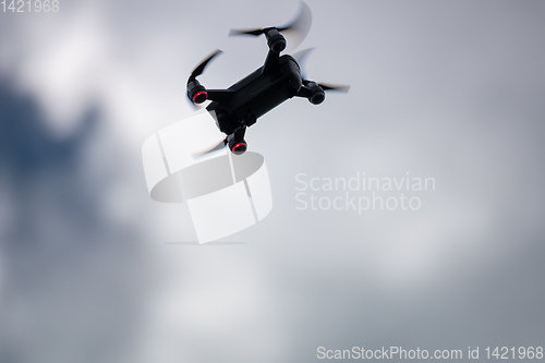 Image of toy drone dramatic sky background 