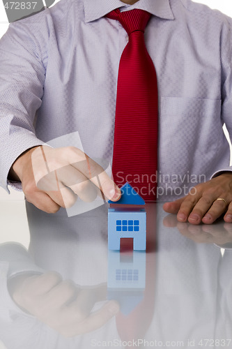 Image of businessman selling a house