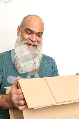 Image of pleased looking bearded man with a carton box