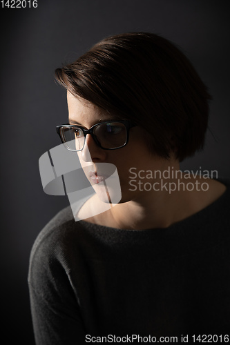 Image of young woman with glasses portrait