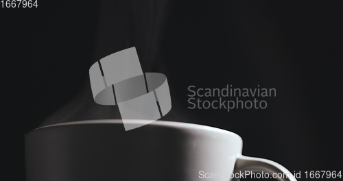 Image of Vapor rising from hot mug closeup footage