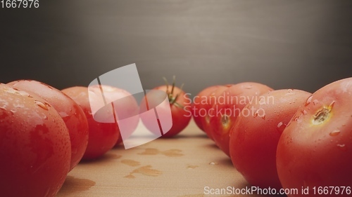 Image of Macro footage in motion of some tomatoes on the table